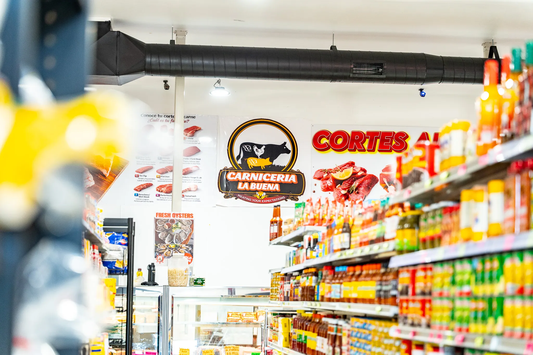 Shelves of authentic Mexican groceries and everyday essentials at Carnicería La Buena