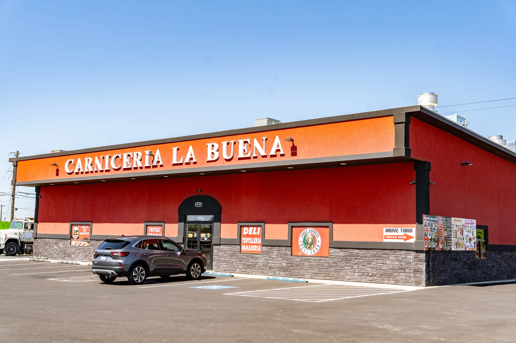 Exterior of the Carnicería La Buena market with the storefront sign